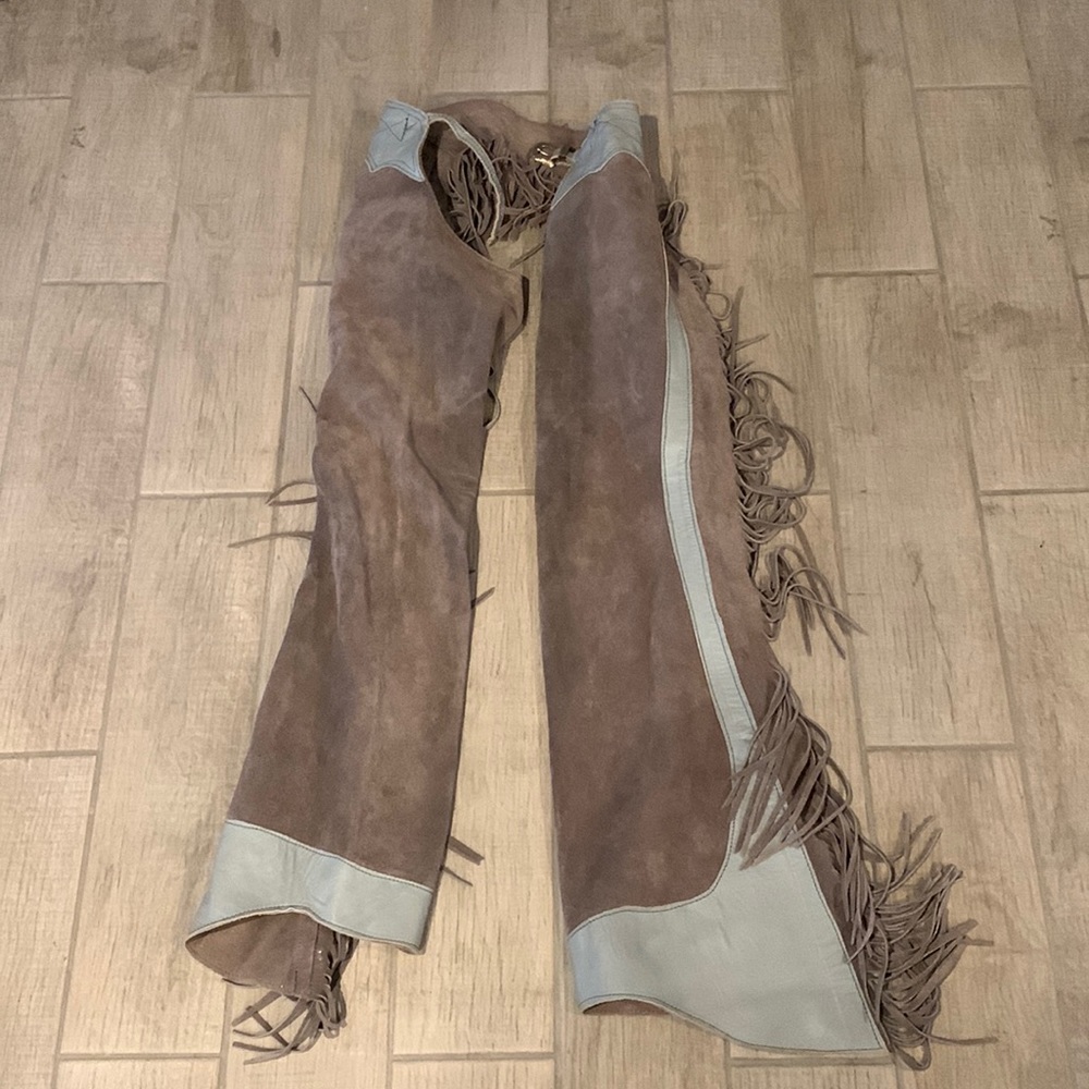 Real cowgirl ass-less chaps. Brand is unknown. Would fit a size small. Very long